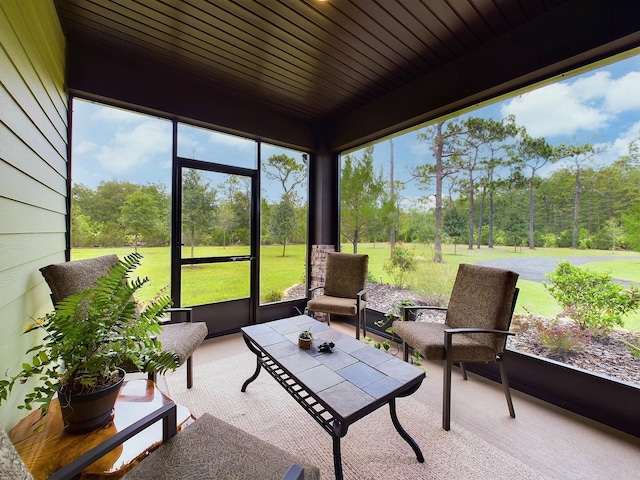 sunroom / solarium featuring wood ceiling