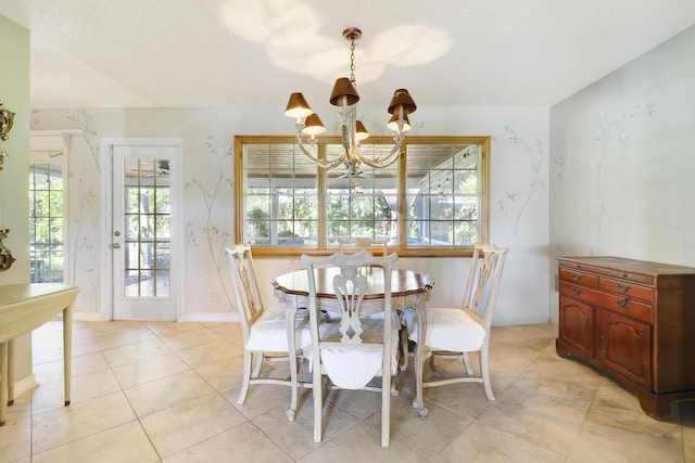 dining area with a notable chandelier and light tile patterned flooring