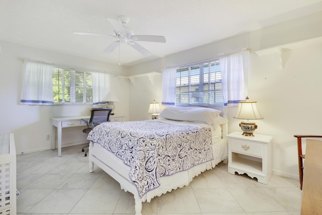 tiled bedroom with multiple windows and ceiling fan