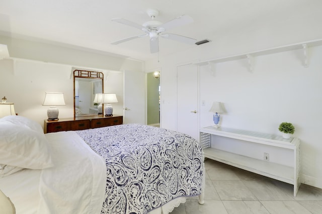 tiled bedroom with ceiling fan