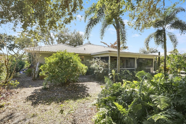 back of house with a sunroom