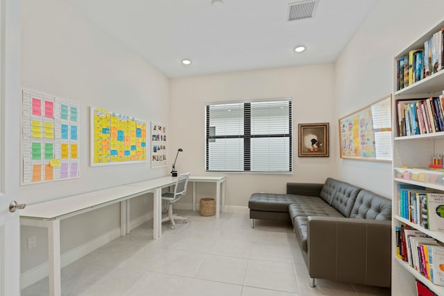 living area featuring light tile patterned flooring