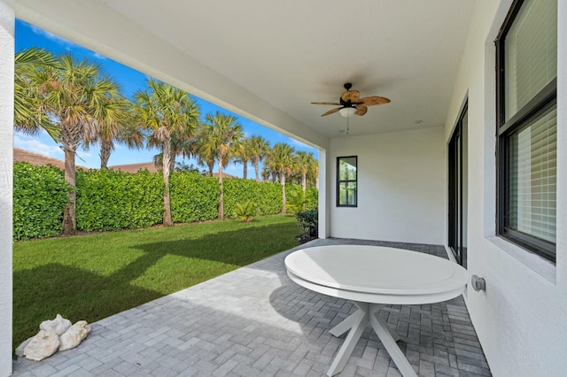 view of patio featuring ceiling fan