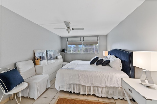 tiled bedroom with ceiling fan