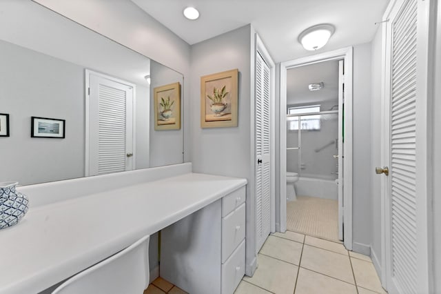 full bathroom with tile patterned flooring, vanity, toilet, and shower / washtub combination