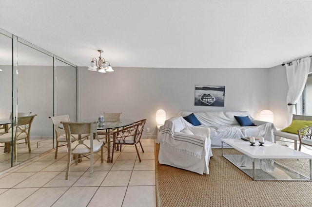 living room with light tile patterned flooring and a notable chandelier