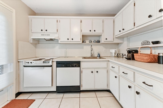 kitchen featuring light tile patterned flooring, white appliances, white cabinetry, and sink