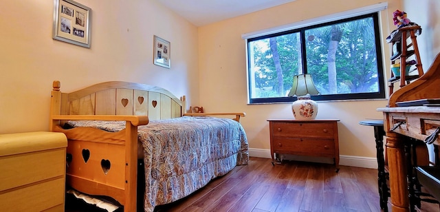 bedroom featuring dark hardwood / wood-style floors