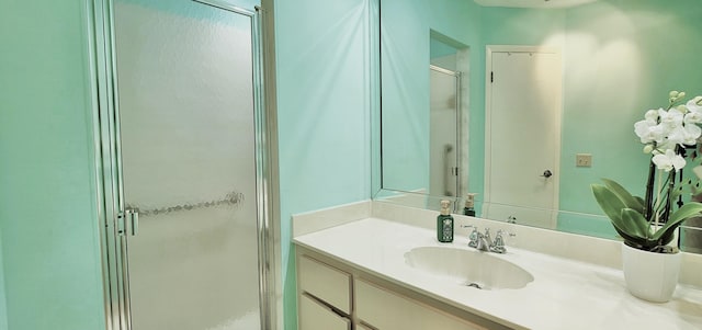 bathroom featuring vanity and an enclosed shower