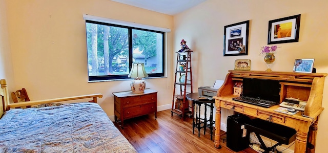 bedroom with wood-type flooring