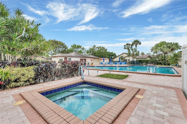 view of pool featuring a community hot tub