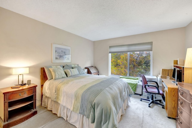 8205 NW 61st St Unit B303, Tamarac, FL 33321 - bedroom with light colored carpet, an office area, and a textured ceiling