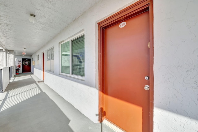 property entrance featuring a porch