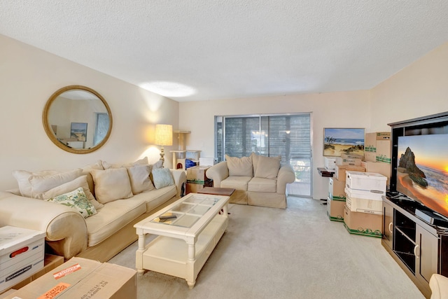 living room with a textured ceiling and light carpet