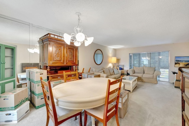 carpeted dining room with a textured ceiling and a notable chandelier