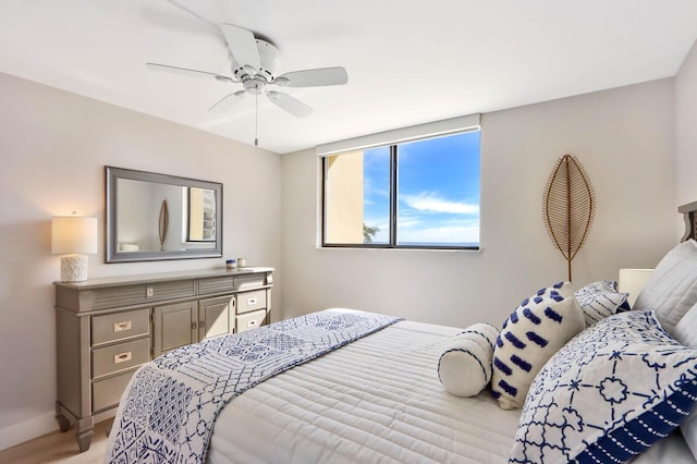 bedroom featuring light hardwood / wood-style floors and ceiling fan