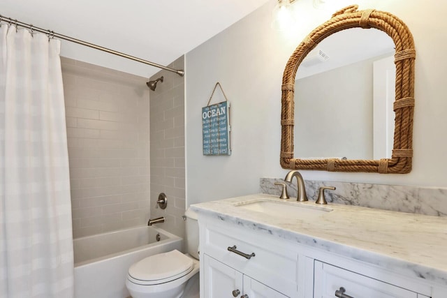 full bathroom with shower / bath combo, toilet, and vanity