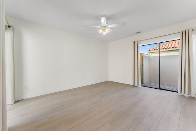 unfurnished room featuring light wood-type flooring and ceiling fan