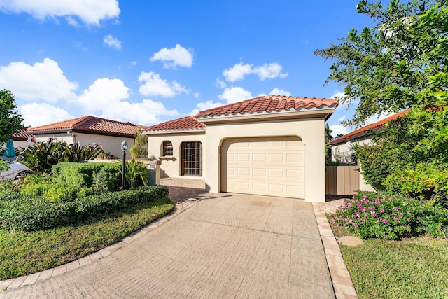 mediterranean / spanish-style house featuring a garage