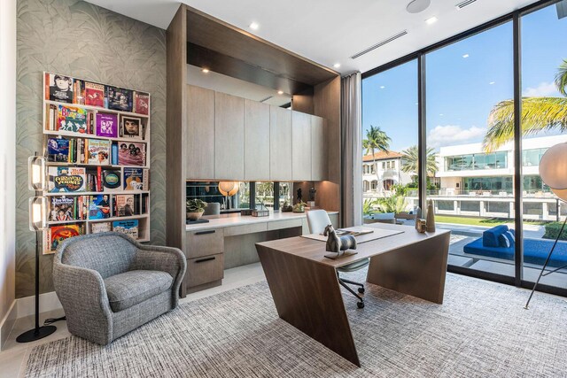 office space featuring floor to ceiling windows and a wealth of natural light