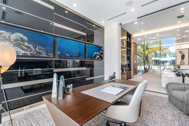 tiled office space featuring floor to ceiling windows