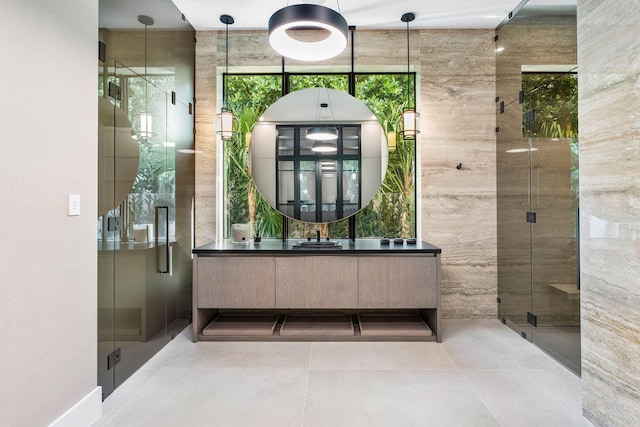 bathroom featuring vanity and a shower with shower door