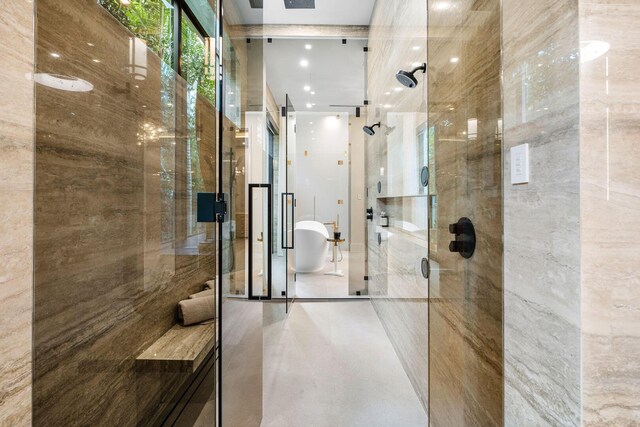 bathroom featuring tile patterned flooring and a shower with door