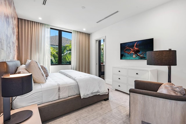 bedroom with light colored carpet