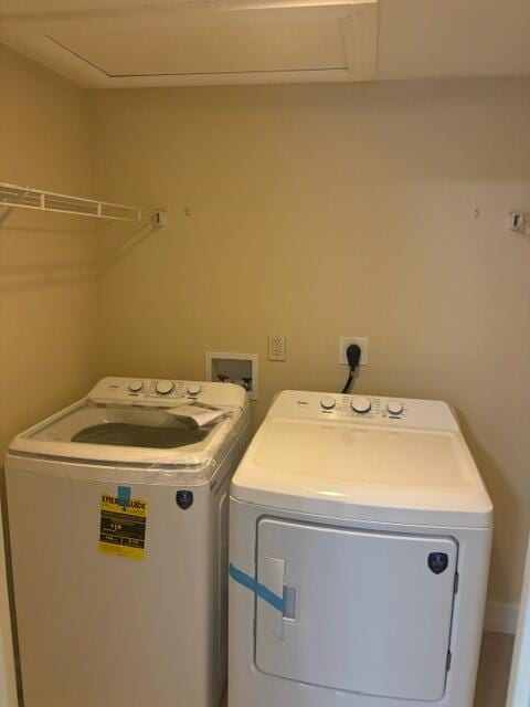 laundry room with washing machine and clothes dryer