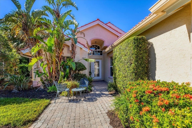 property entrance with a patio area