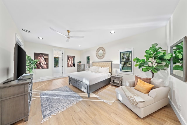 bedroom with access to exterior, light hardwood / wood-style floors, and ceiling fan