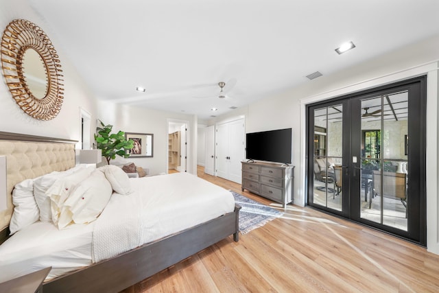 bedroom with access to exterior, french doors, light wood-type flooring, and ceiling fan