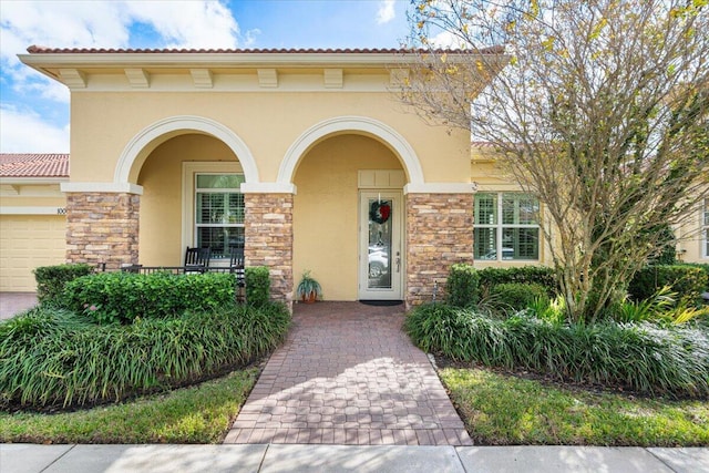 view of exterior entry featuring a porch