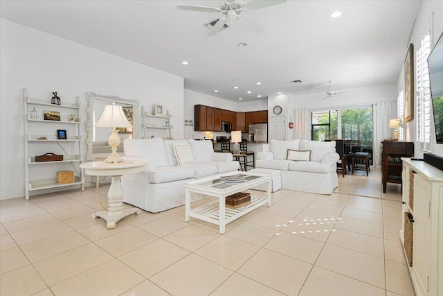 tiled living room with ceiling fan