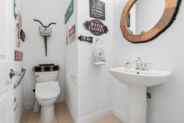 bathroom with tile patterned floors and toilet