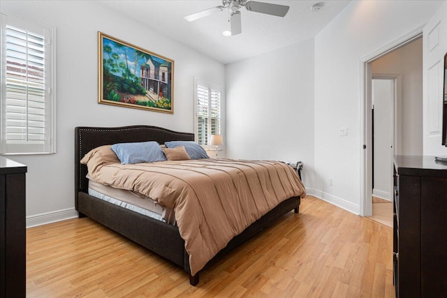 bedroom featuring light wood-type flooring and ceiling fan