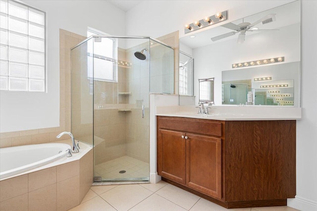 bathroom with tile patterned floors, ceiling fan, vanity, and shower with separate bathtub