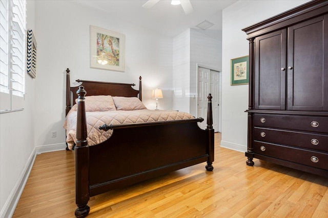 bedroom featuring ceiling fan, a closet, and light hardwood / wood-style flooring