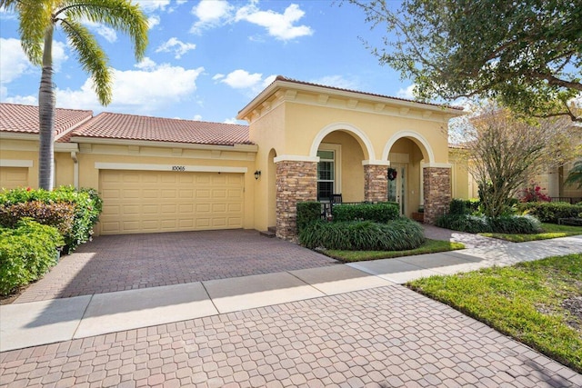 mediterranean / spanish house featuring a garage