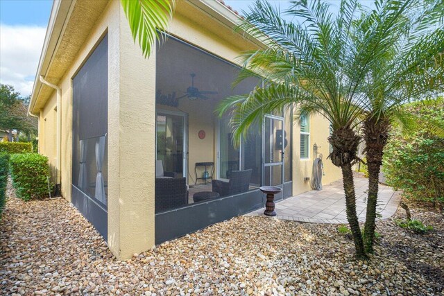 view of patio / terrace with a sunroom