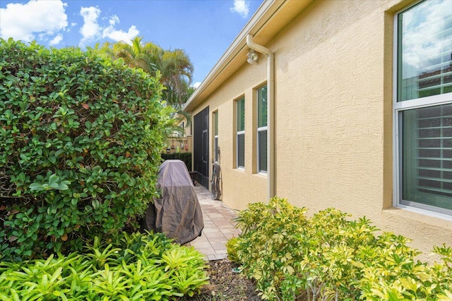 view of side of property with a patio