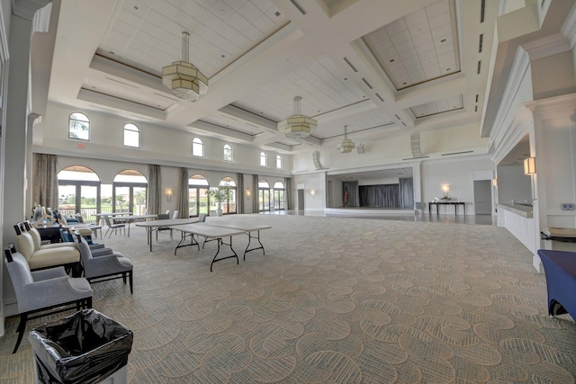 interior space featuring beam ceiling, ceiling fan, a towering ceiling, and coffered ceiling