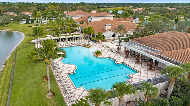 view of swimming pool with a water view and a patio