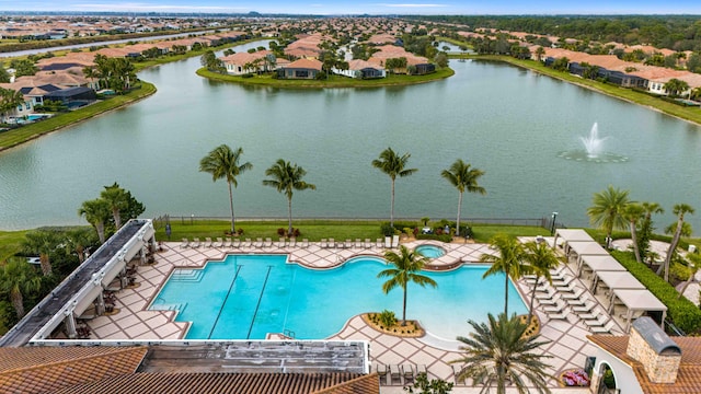 view of pool featuring a water view