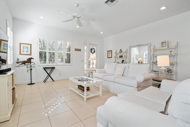 tiled living room featuring ceiling fan