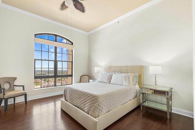 bedroom featuring dark hardwood / wood-style floors, ceiling fan, and ornamental molding