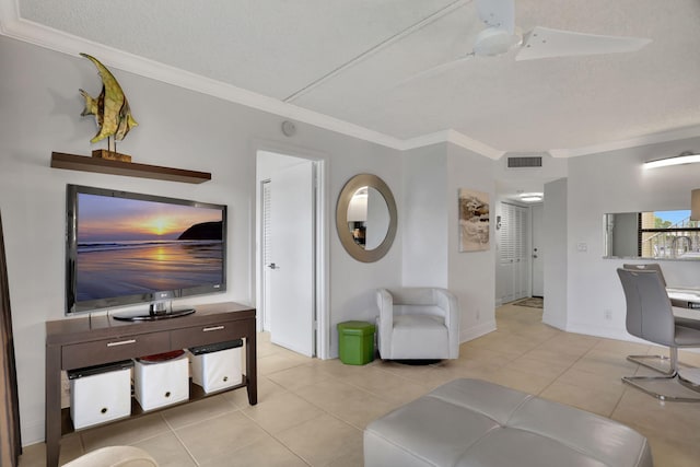 tiled living room featuring a textured ceiling and crown molding