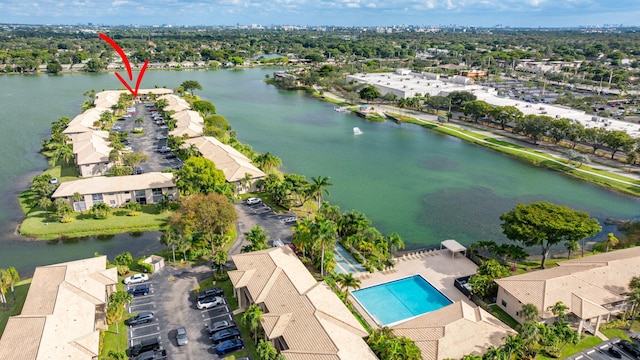 birds eye view of property with a water view