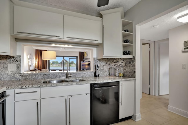 kitchen with sink, white cabinetry, black dishwasher, and tasteful backsplash