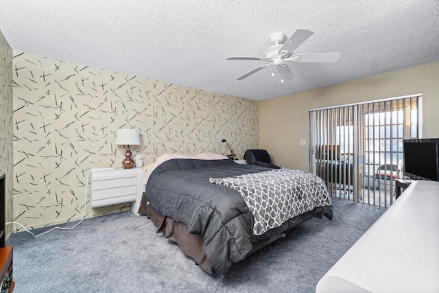 carpeted bedroom with ceiling fan and a textured ceiling